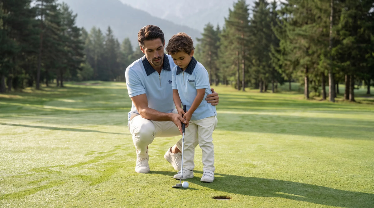 Father guiding his son's putt, both in the Romimi sky blue Adam polo