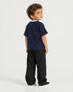 Little boy wearing the Romimi Alex Contrast Collar Tee, back view