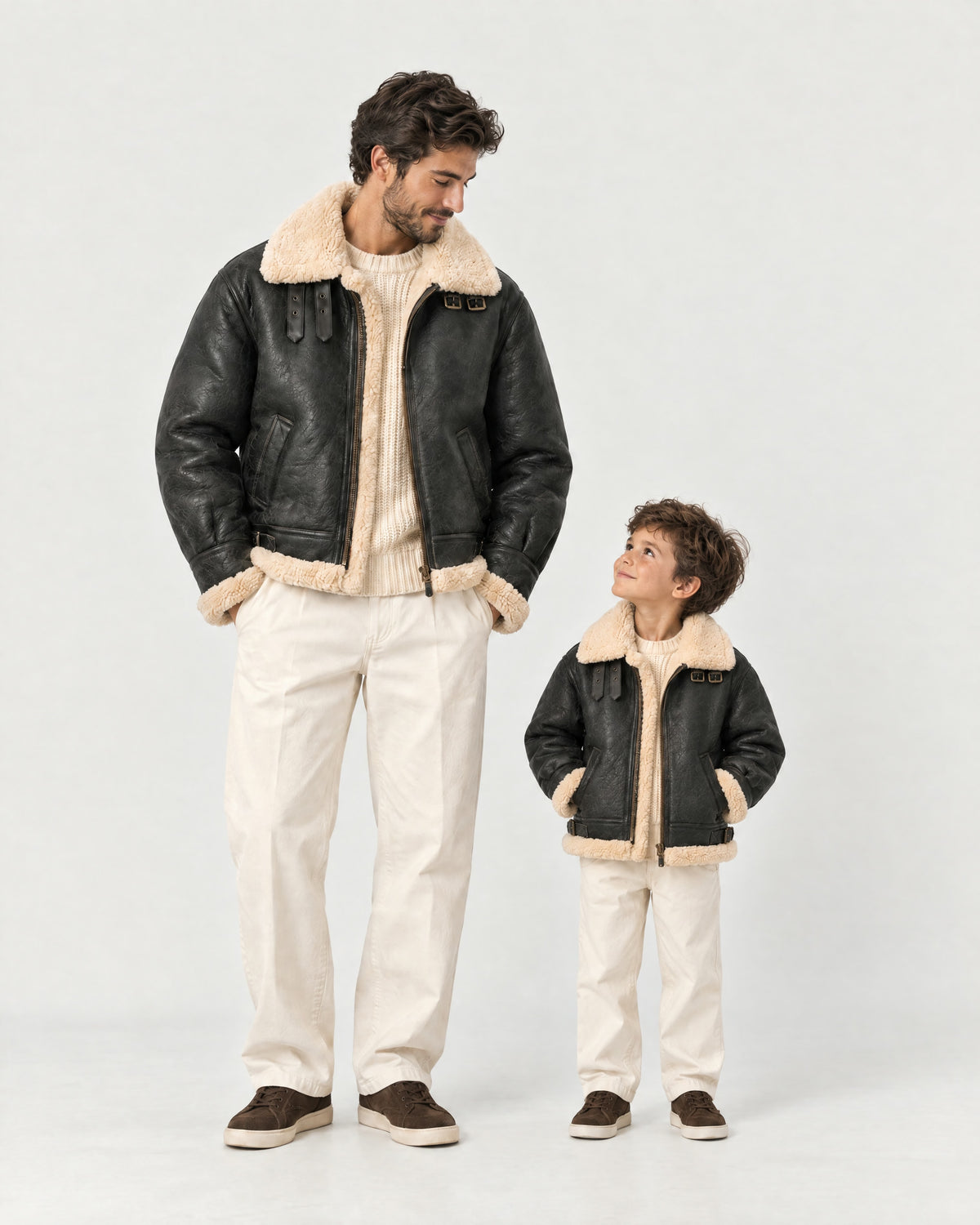 Father and son wearing the Romimi aviator jacket in black with a cream collar