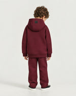 Little boy wearing the Romimi Bond Signature Hoodie, back view