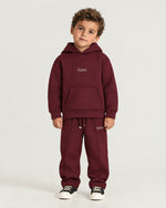 Little boy wearing the Romimi Bond Signature Hoodie, front view