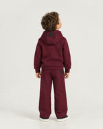 Little boy wearing the Romimi Bond Signature Jogger, back view