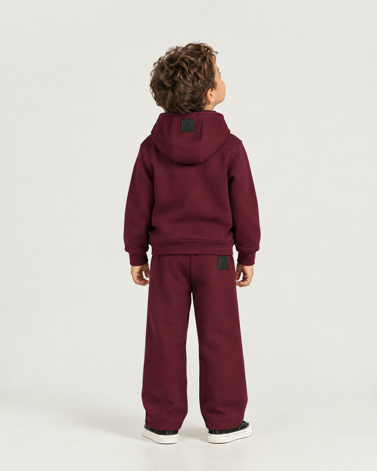 Little boy wearing the Romimi Bond Signature Jogger, back view