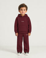Little boy wearing the Romimi Bond Signature Jogger, full length