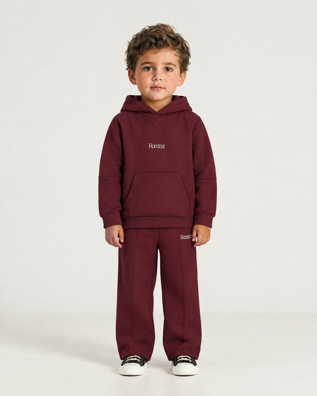 Little boy wearing the Romimi Bond Signature Jogger, full length