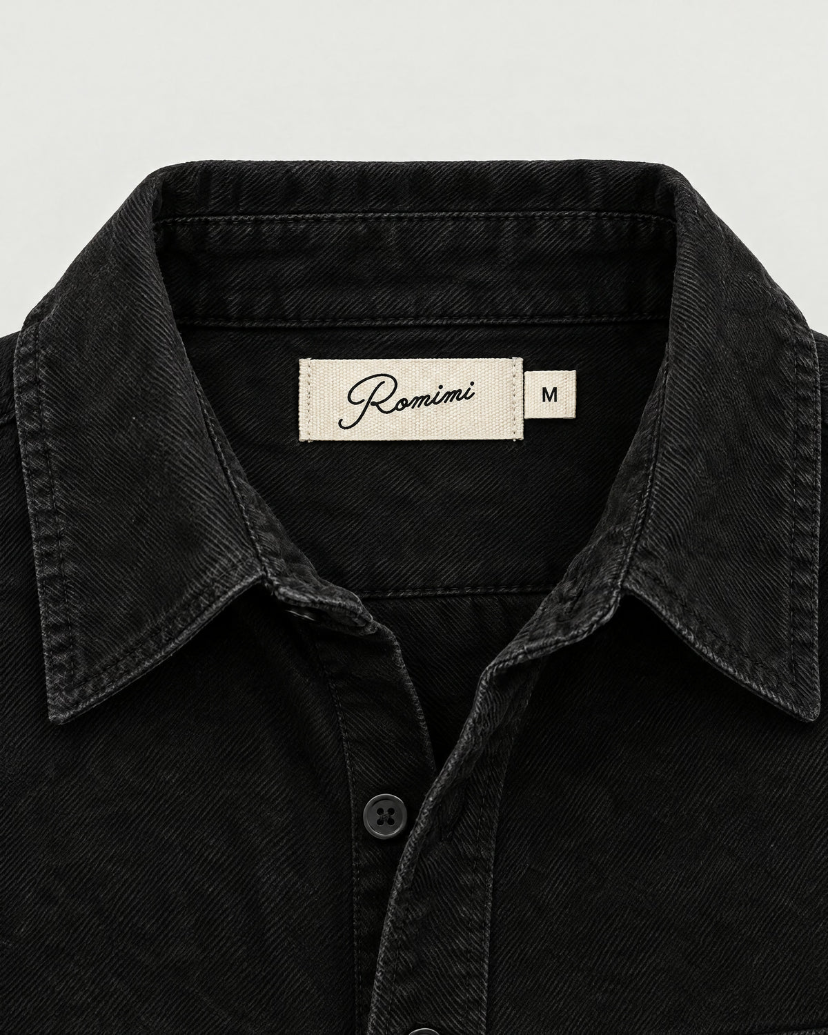 Romimi Brushed Overshirt in Black, label close-up