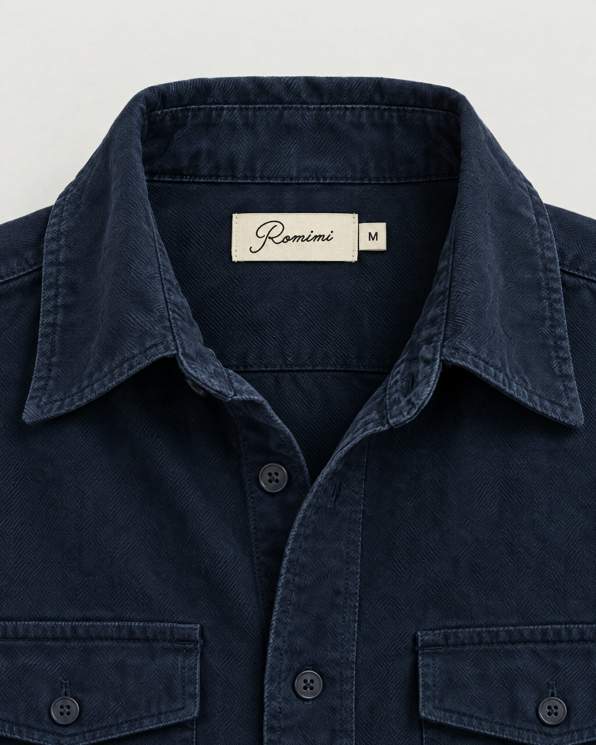 Romimi Brushed Overshirt in Navy, label close-up