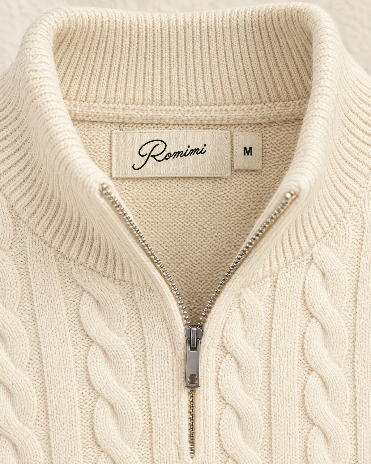 Romimi Cable Knit Quarter-Zip in Ecru, label close-up