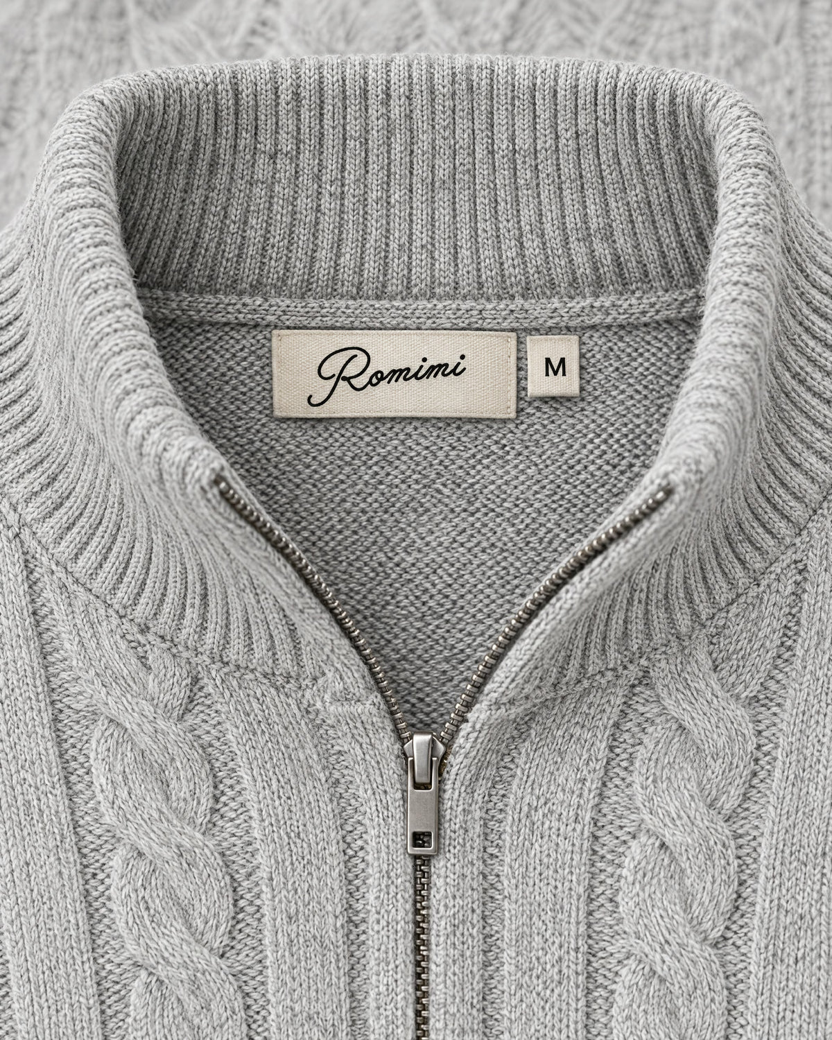 Romimi Cable Knit Quarter-Zip in Grey Melange, label close-up