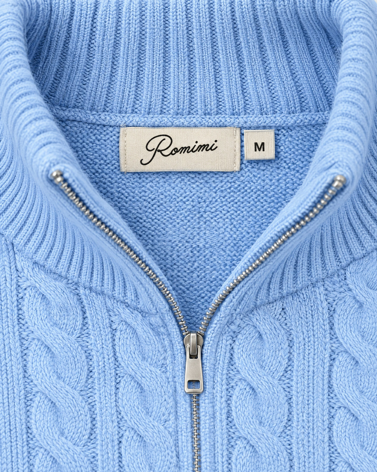 Romimi Cable Knit Quarter-Zip in Sky Blue, label close-up