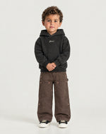 Little boy wearing the Romimi Carpenter Pant - Chocolat, front view