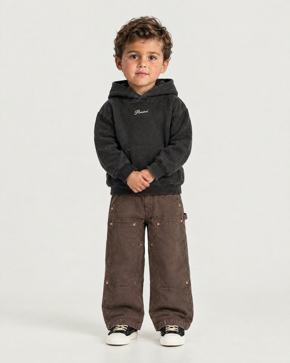 Little boy wearing the Romimi Carpenter Pant - Chocolat, front view