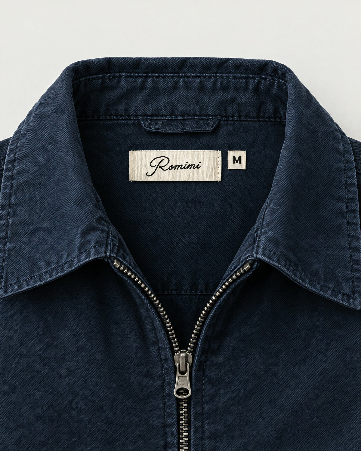 Romimi Cotton Twill Harrington in Navy, label close-up