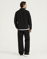 Romimi Faux Suede Overshirt in Black, back view, worn