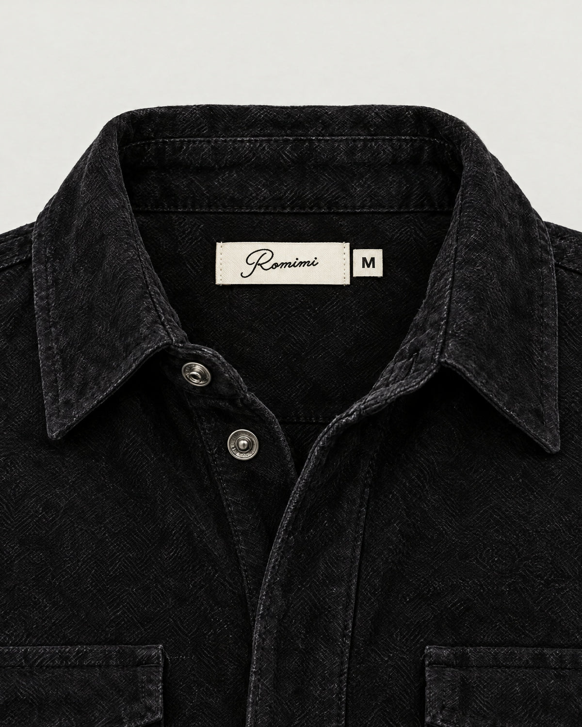 Romimi Faux Suede Overshirt in Black, label close-up