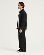 Romimi Faux Suede Overshirt in Black, side view, worn