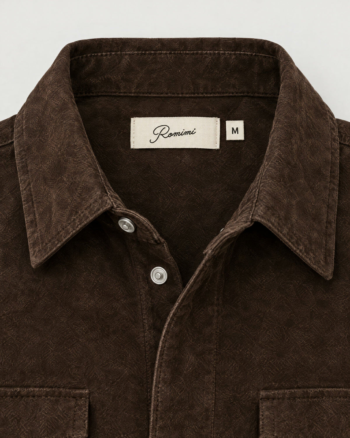 Romimi Faux Suede Overshirt in Chocolate, label close-up