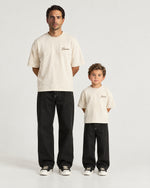 Father and son wearing the Romimi Graphic Tee - Beige