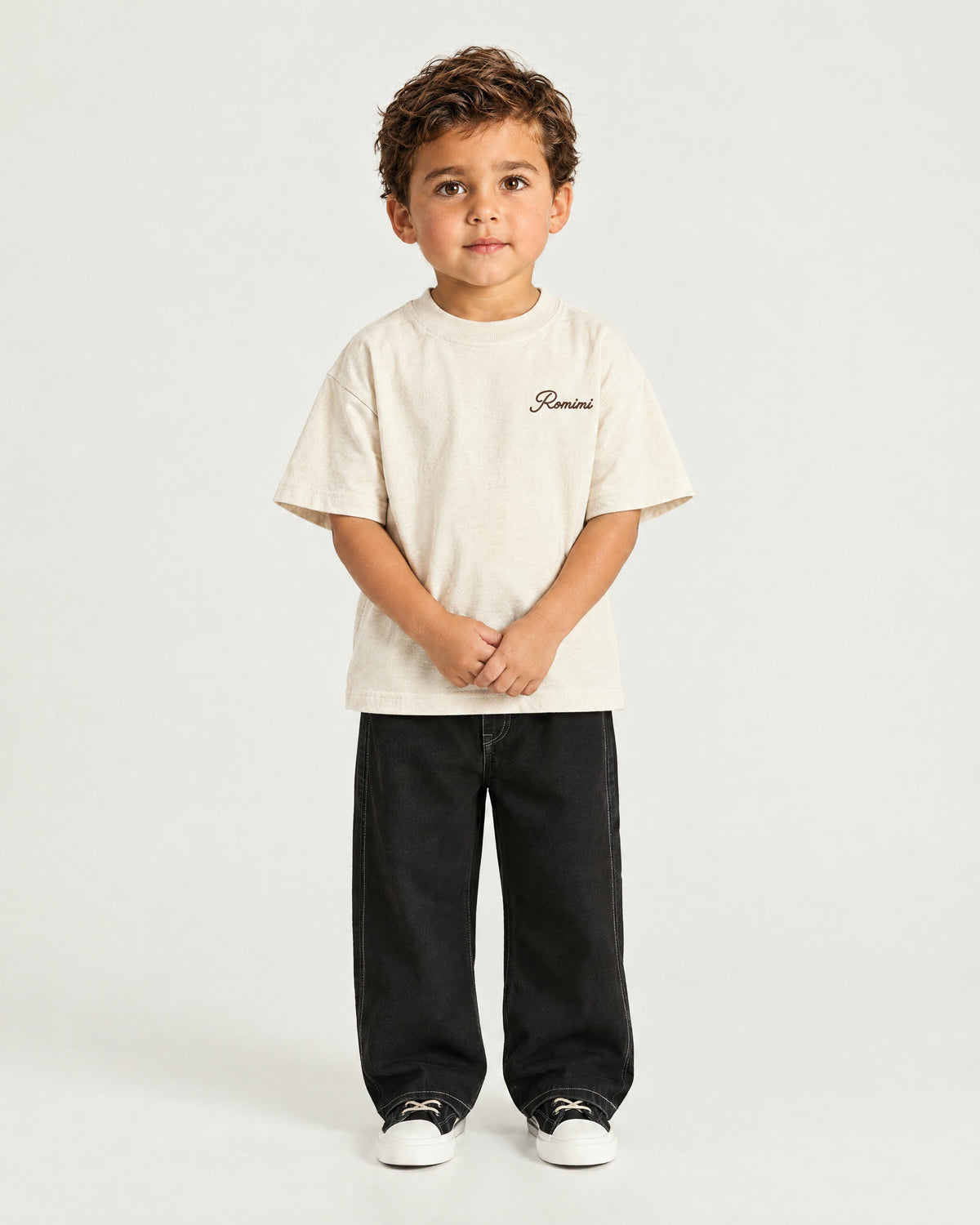 Little boy wearing the Romimi Graphic Tee - Beige, front view