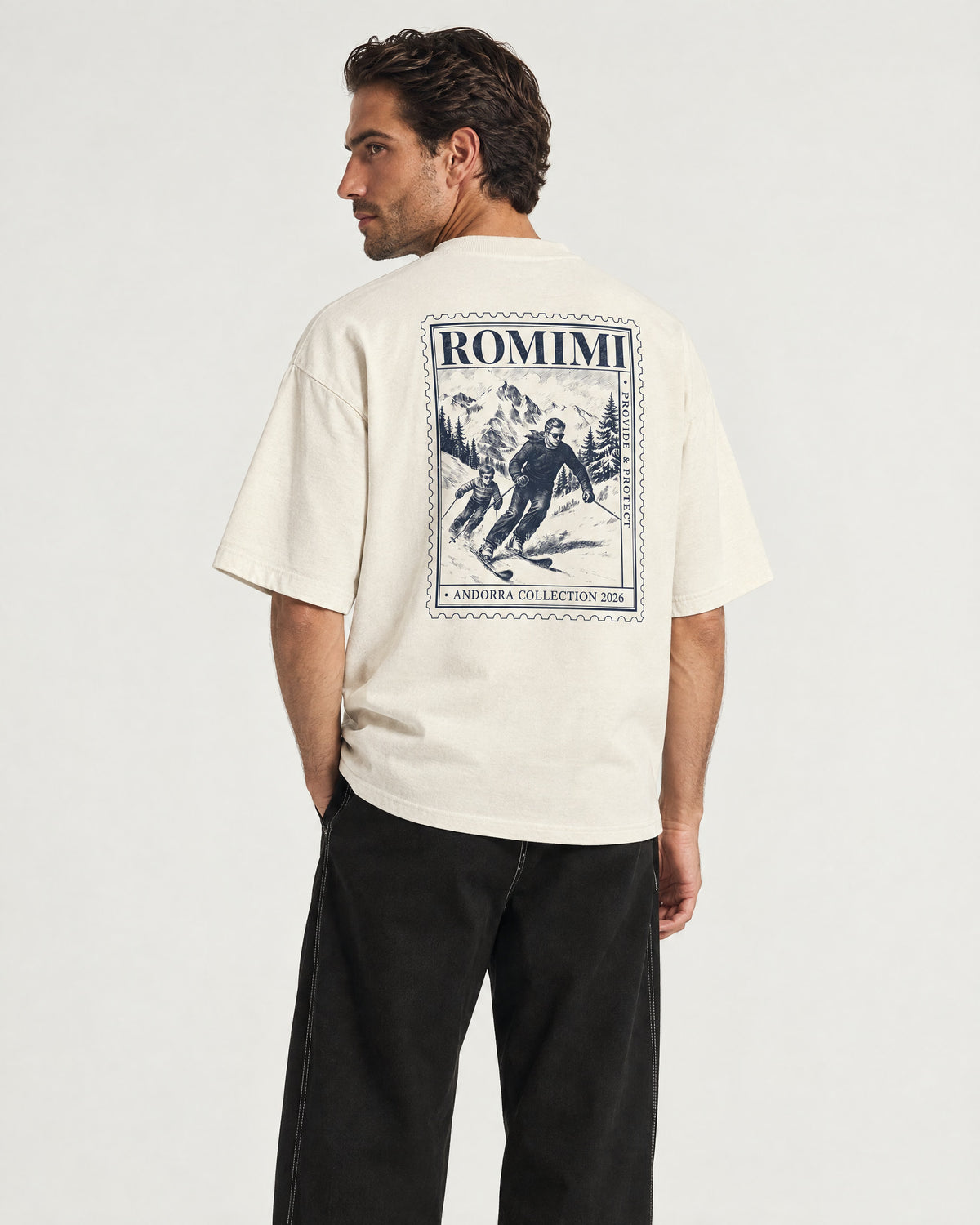 Man wearing the Romimi Graphic Tee - Beige, back view