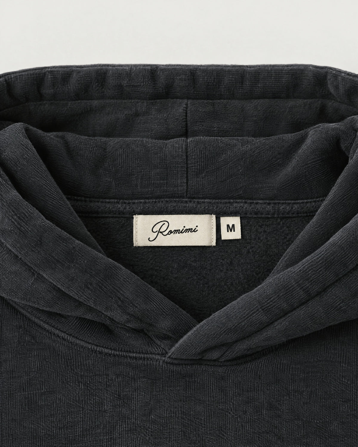 Romimi Heavyweight Hoodie in Charcoal, label close-up