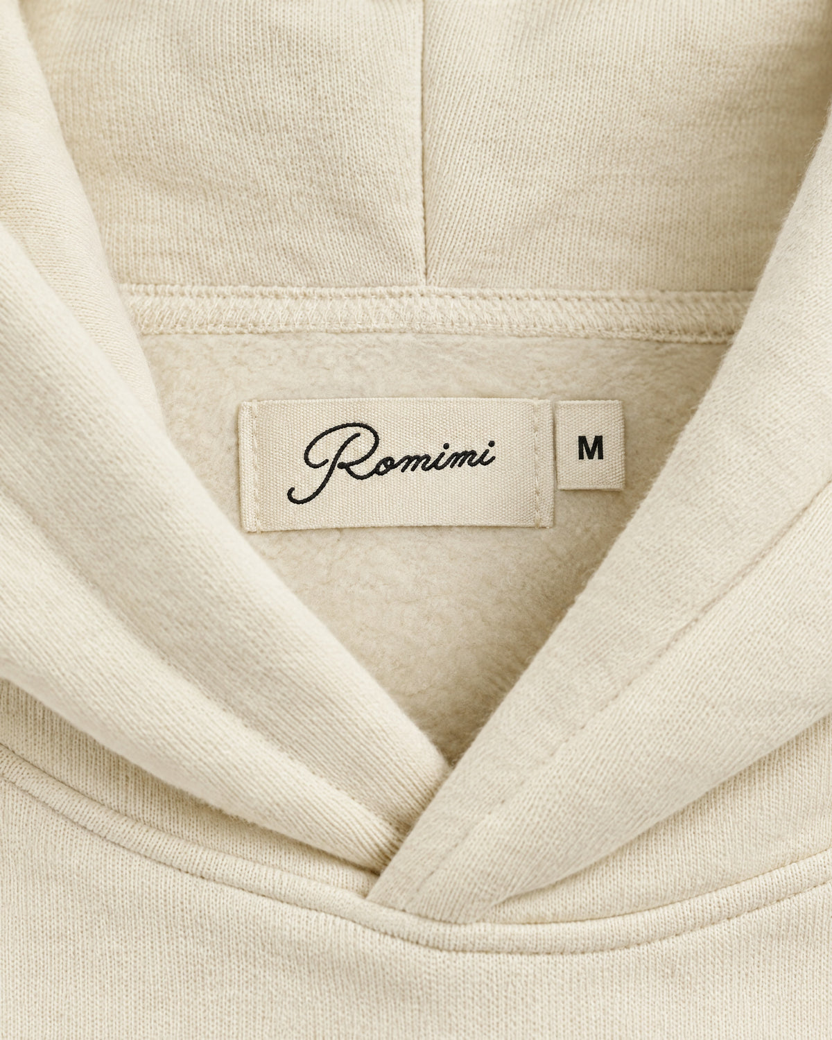 Romimi Heavyweight Hoodie in Ecru, label close-up