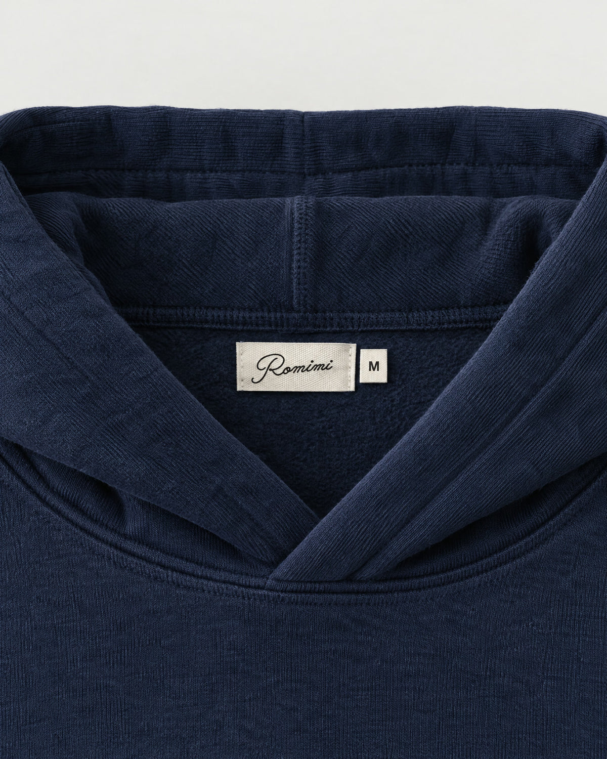 Romimi Heavyweight Hoodie in Navy, label close-up