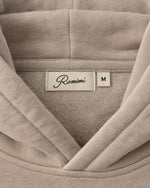 Romimi Heavyweight Hoodie in Sand, label close-up