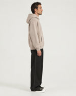 Romimi Heavyweight Hoodie in Sand, side view, worn