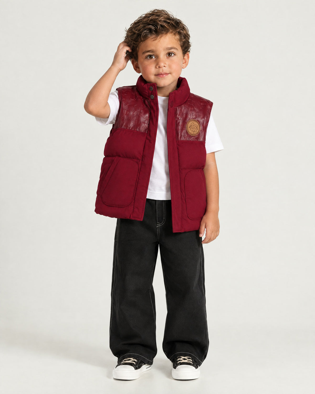 Little boy wearing the Romimi Heritage Gilet, front view