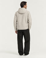 Romimi Hooded Tech Jacket in Beige, back view, worn