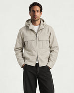 Romimi Hooded Tech Jacket in Beige, worn