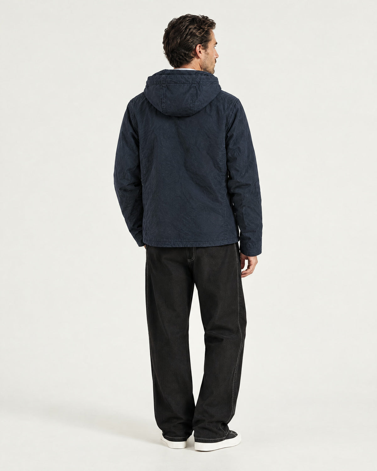 Romimi Hooded Tech Jacket in Navy, back view, worn