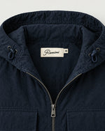 Romimi Hooded Tech Jacket in Navy, label close-up