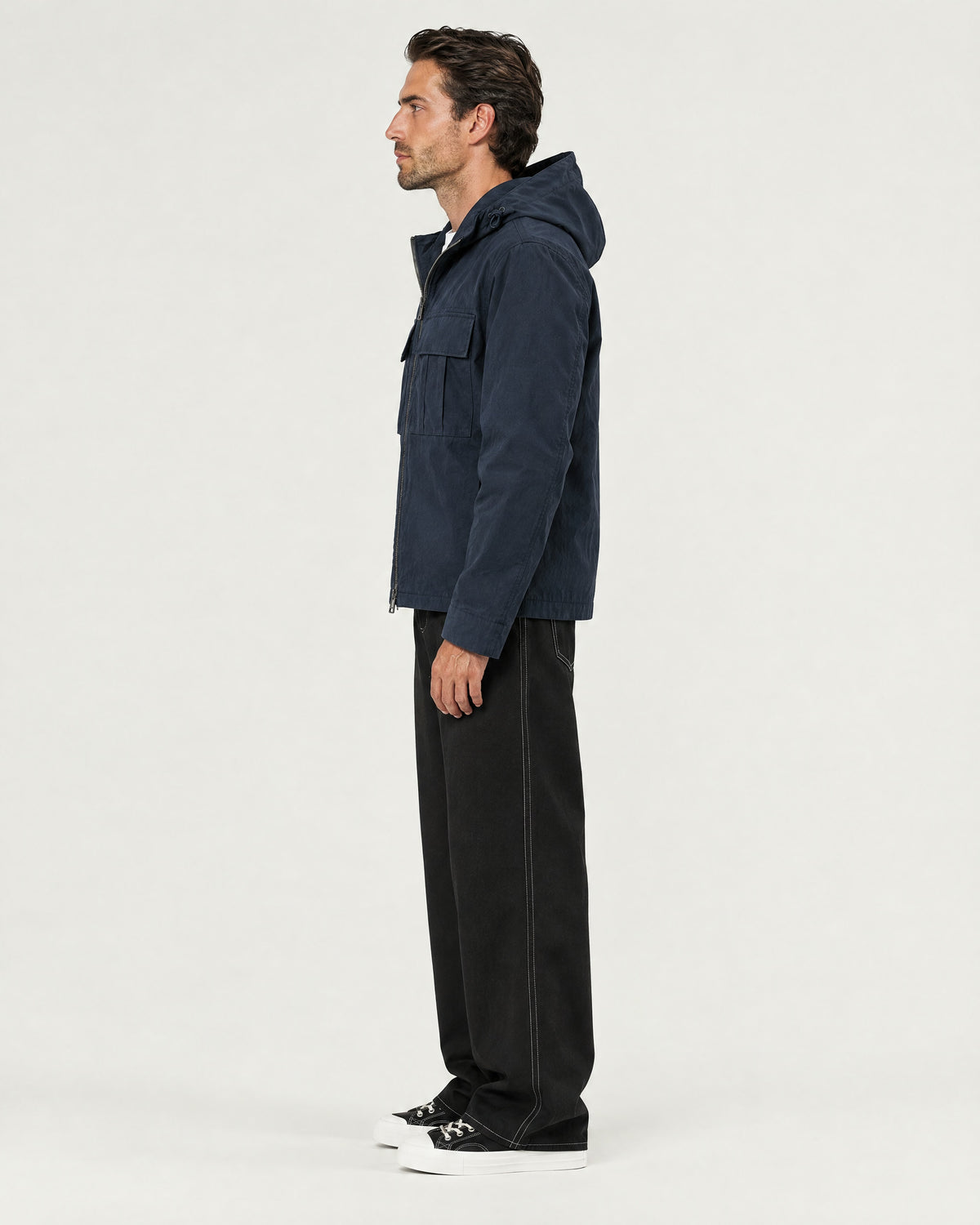 Romimi Hooded Tech Jacket in Navy, side view, worn