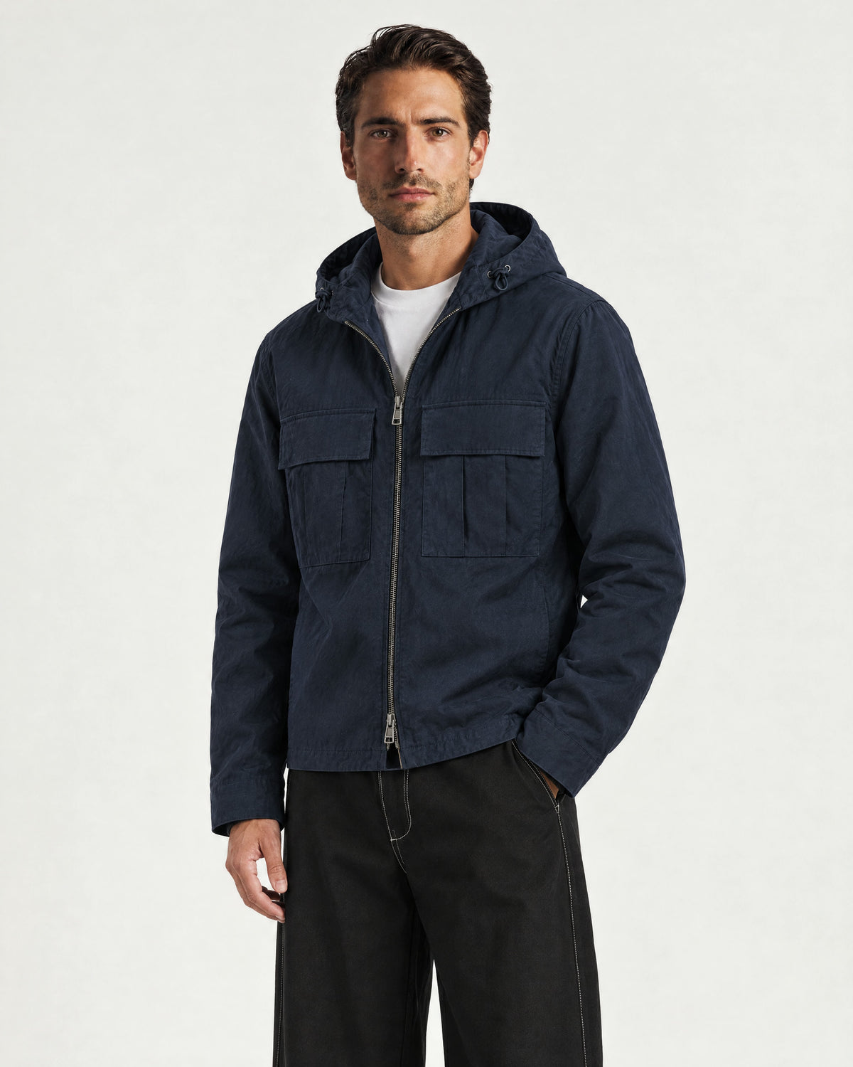 Romimi Hooded Tech Jacket in Navy, worn