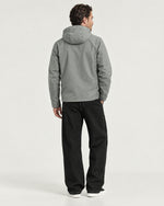 Romimi Hooded Tech Jacket in Sage Grey, back view, worn