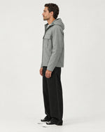 Romimi Hooded Tech Jacket in Sage Grey, side view, worn