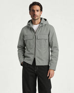 Romimi Hooded Tech Jacket in Sage Grey, worn