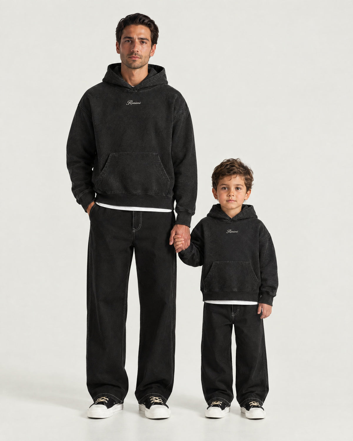 Father and son wearing the Romimi Hoodie - Black