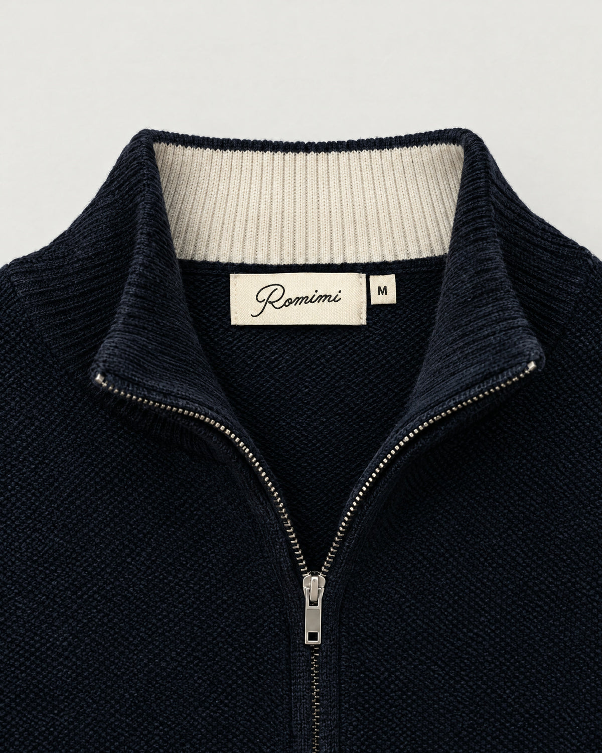 Romimi Knit Zip Cardigan in Navy, label close-up