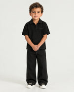 Little boy wearing the Romimi Laurent Classic Ribbed Polo, front view