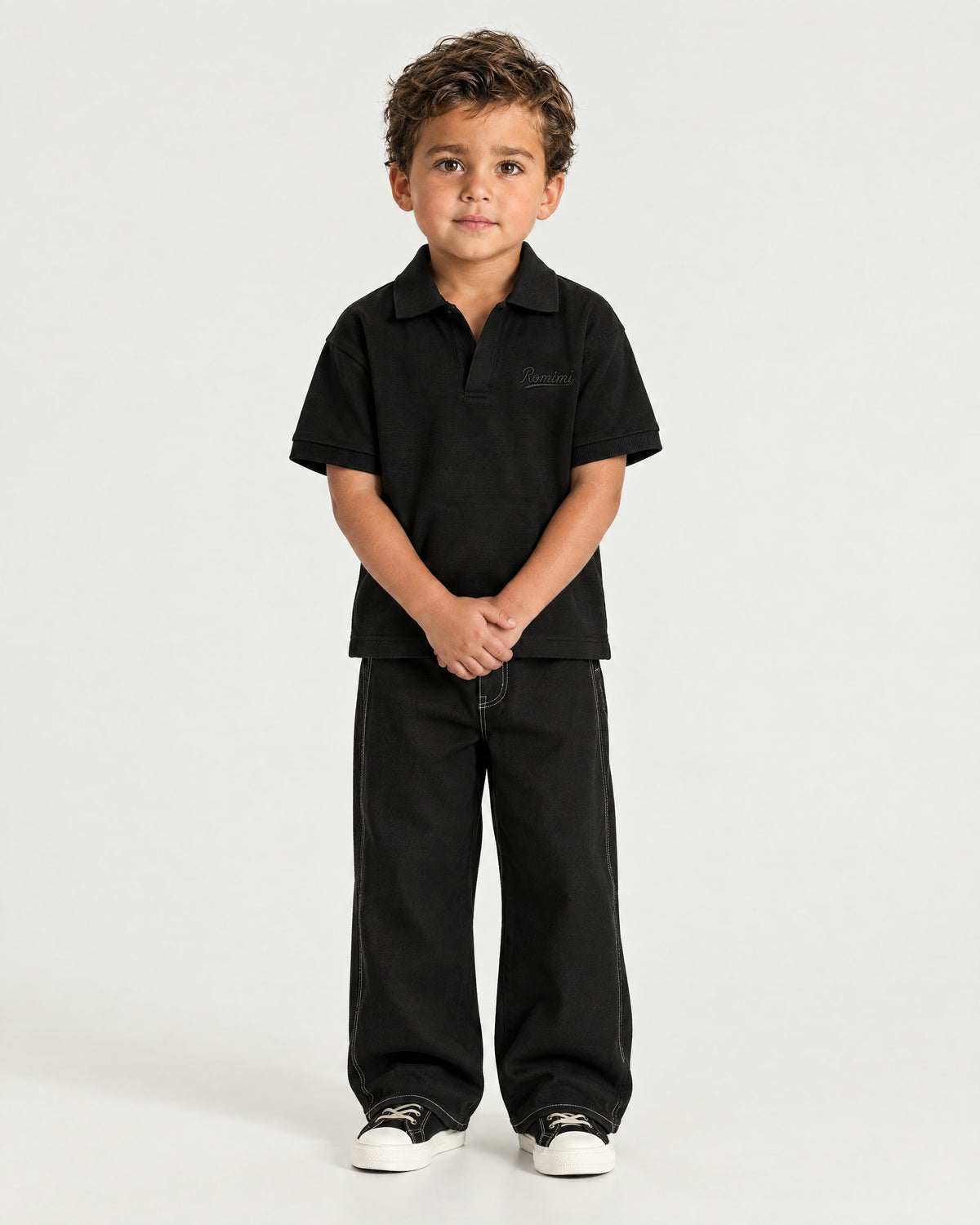 Little boy wearing the Romimi Laurent Classic Ribbed Polo, front view