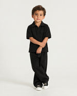 Little boy wearing the Romimi Laurent Classic Ribbed Polo, full length