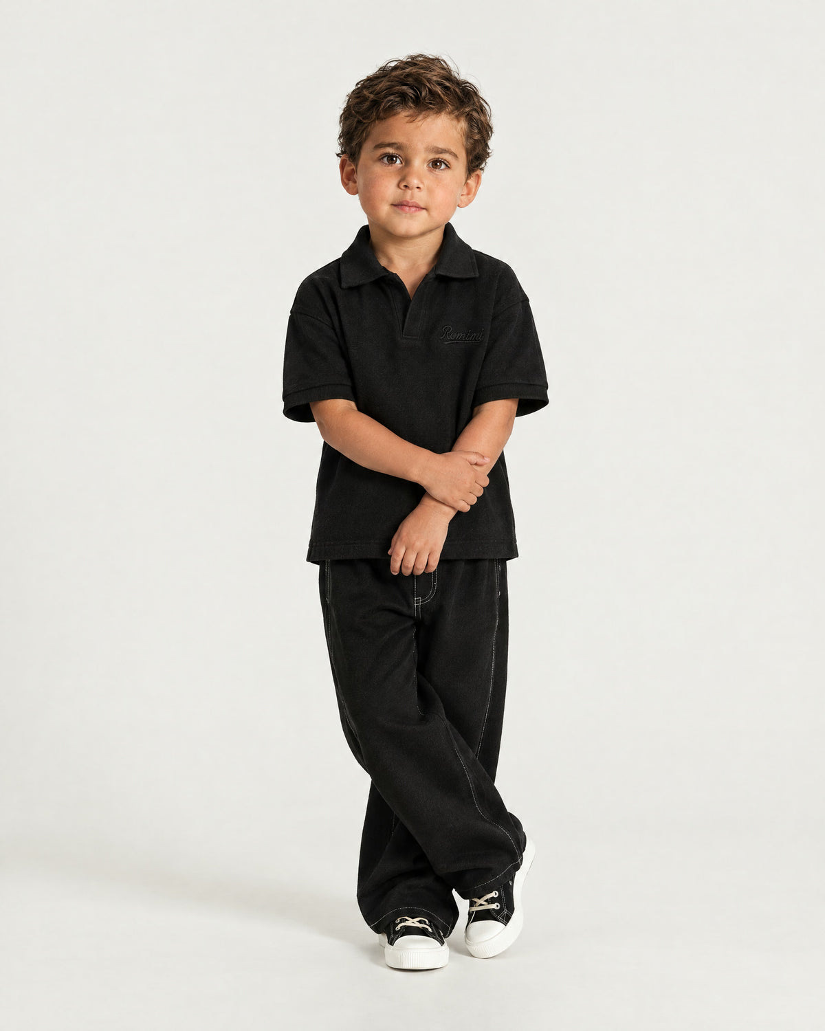 Little boy wearing the Romimi Laurent Classic Ribbed Polo, full length