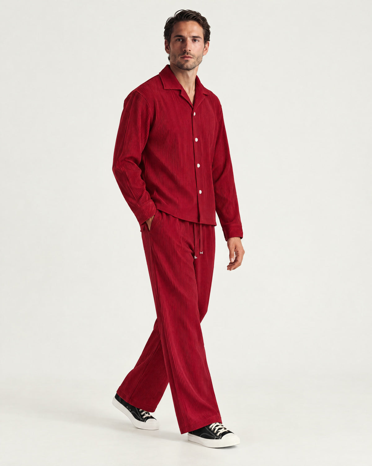 Man wearing the Romimi Pleat Pant, three-quarter view