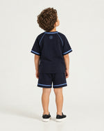 Little boy wearing the Romimi Léon Cotton Shirt, back view