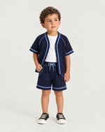 Little boy wearing the Romimi Léon Cotton Short, front view