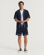 Man wearing the Romimi Léon Cotton Short, front view