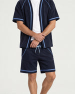 Man wearing the Romimi Léon Cotton Short, full length